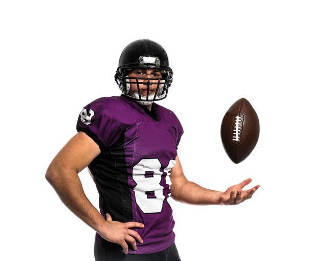 American football player with ball on white background - Foto, Imagem