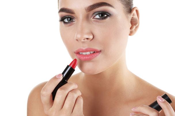 Portrait of beautiful woman with lipstick on white background. Stylish makeup - Fotoğraf, Görsel