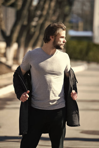 Man feel hot in grey tshirt coat on sunny day - Foto, immagini