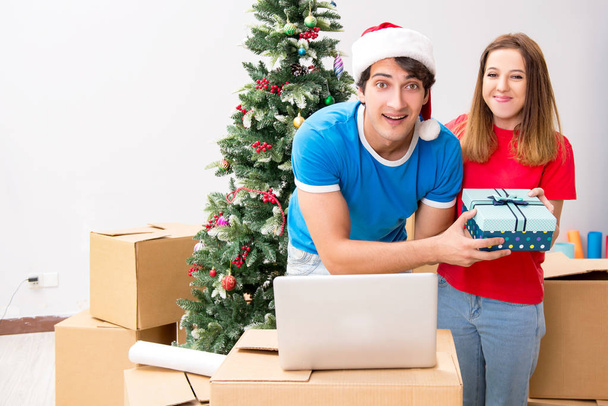 Young family celebrating christmas in new home - Photo, Image