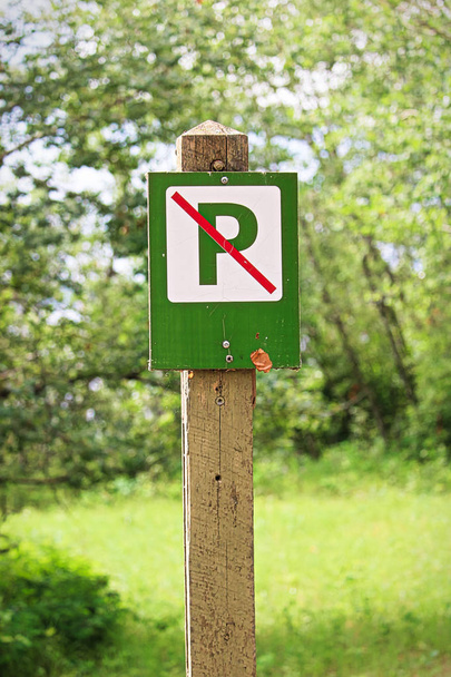 Closeup of a green no parking sign. - Photo, Image