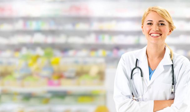 Woman pharmacist working at pharmacy. Medical healthcare and doctor staff service. - Foto, Imagem
