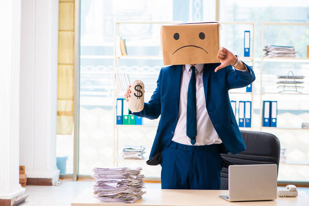 Unhappy man with box instead of his head  - Photo, Image