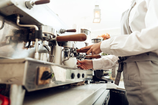 Close up of female barista preparing coffee - Photo, Image