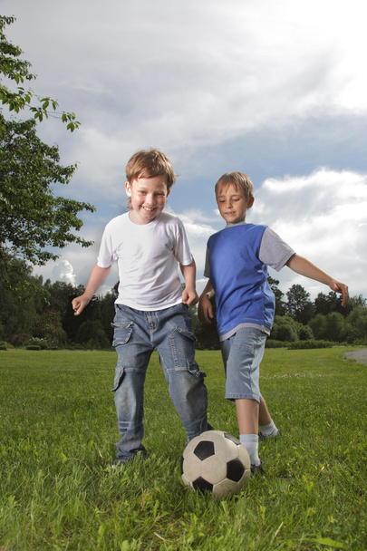 two happy boy play in soccer - 写真・画像