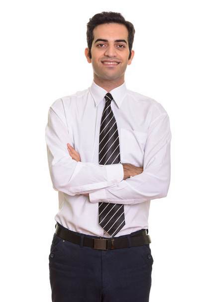 Fiatal boldog perzsa üzletember, mosolygós, keresztbe - Fotó, kép