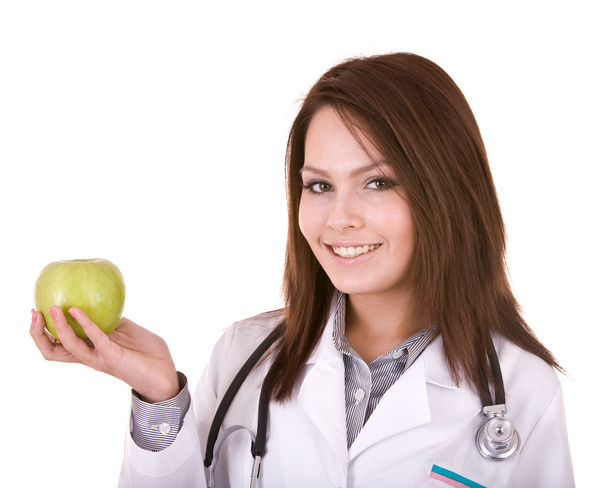 Doctor with stethoscope and apple. - Foto, afbeelding