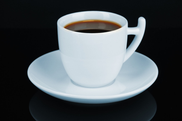 Cup of strong coffee isolated on black - Φωτογραφία, εικόνα