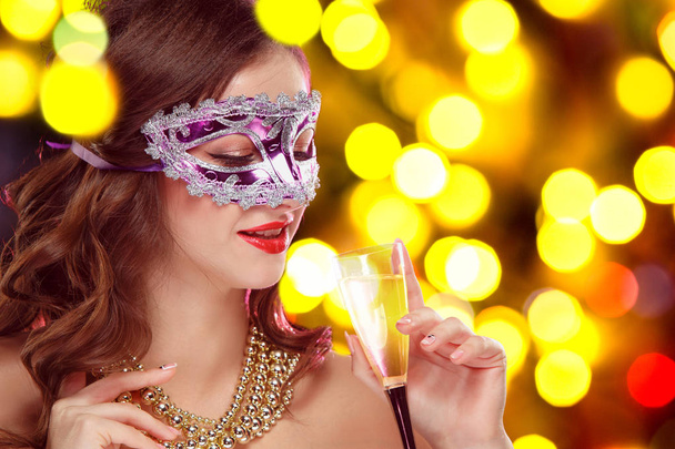 Beauty model woman wearing venetian masquerade carnival mask at party - 写真・画像