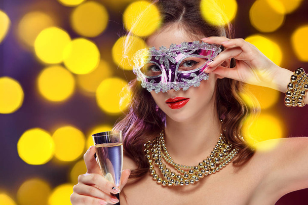 Beauty model woman wearing venetian masquerade carnival mask at party - Фото, зображення