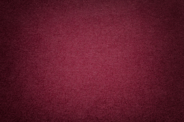 Het patroon van de achtergrond van de vintage donker rood papier met vignet. Structuur van dichte kastanjebruine kraft karton met frame. Vilt wijn gradient achtergrond closeup. - Foto, afbeelding