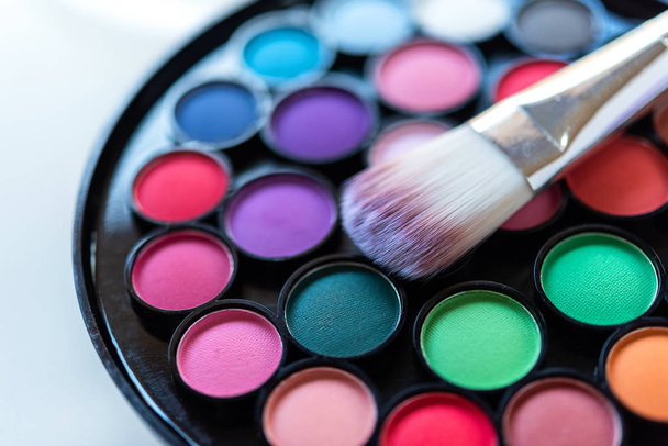 Eyeshadow Colorful pastel cosmetics and make up plate with brush, Copy space.  Lifestyle Beauty Concept - Valokuva, kuva