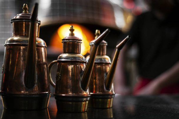classic olive oil copper cruet traditional dispenser detail in italian restaurant - Photo, Image
