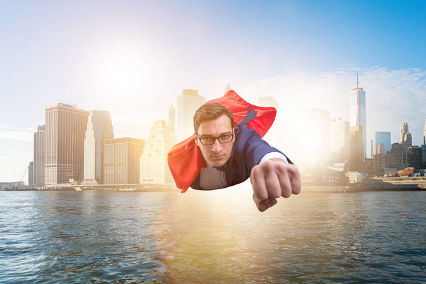 Superhero businessman flying over the city - Photo, Image