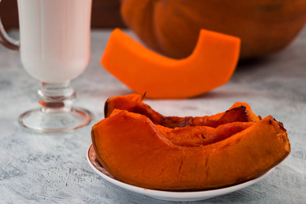 Diet dish. Baked pumpkin with milk. Light background.  - Photo, Image