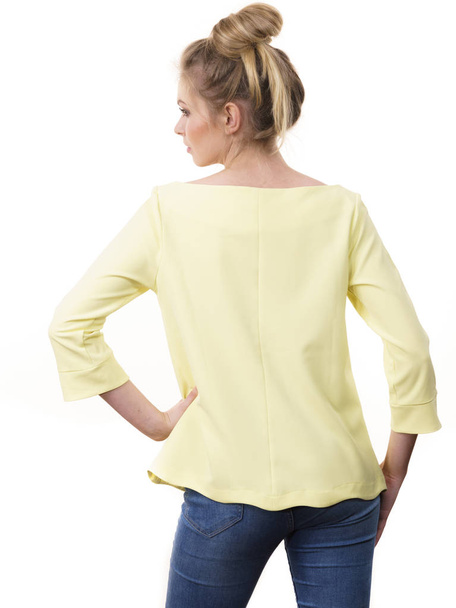 Adult woman presenting her casual beautiful outfit, long sleeved yellow top from back. - Φωτογραφία, εικόνα