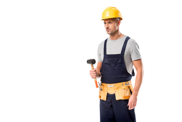 construction worker in tool belt holding hammer isolated on white - Fotoğraf, Görsel