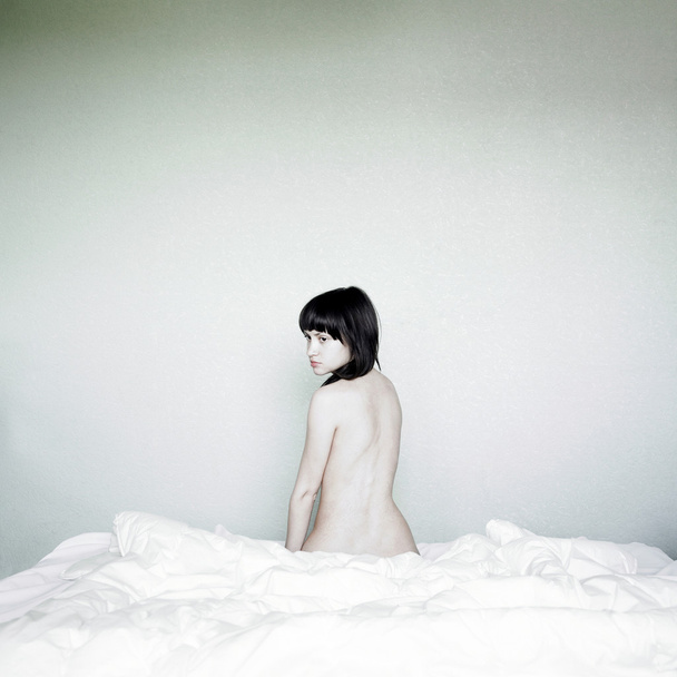 Young beautiful woman in bed - Fotó, kép