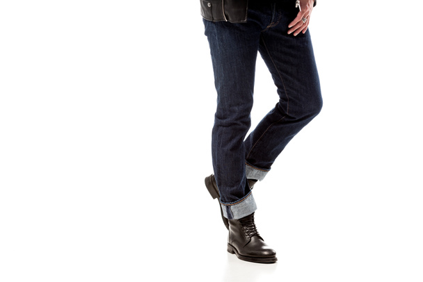 partial view of stylish man wearing denim and leather boots isolated on white - Photo, Image