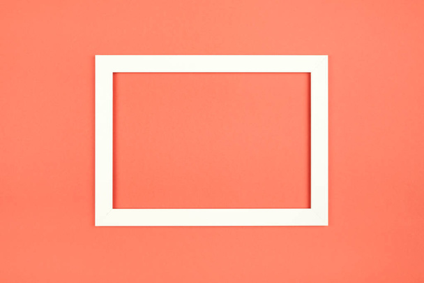 Empty picture frame on textured pastel colored background. Abstract minimalist composition - Photo, image