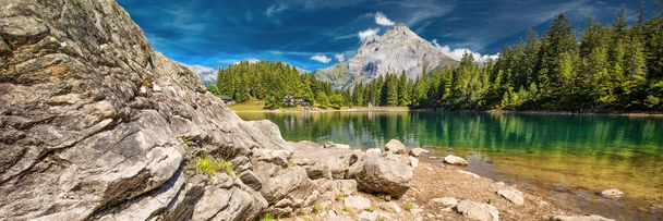 Arnisee with Swiss Alps. Arnisee is a reservoir in the Canton of Uri, Switzerland, Europe.  - Photo, Image