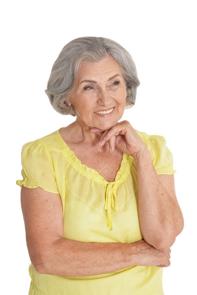 portrait of beautiful senior woman, posing against white background - 写真・画像