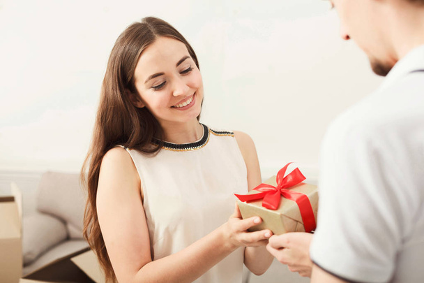 Happy couple exchanging gifts, copy space - Foto, Imagem