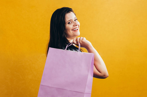 Woman in shopping. Happy woman with shopping bags. Consumerism, shopping, lifestyle concept - Fotó, kép