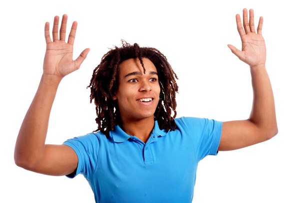 Young man posing with hands up against white background - Φωτογραφία, εικόνα