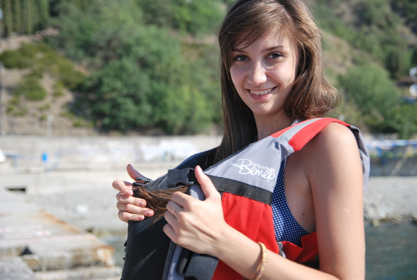 young girl posing in a sea athletes on the coast of the Black Sea in Crimea - Фото, зображення