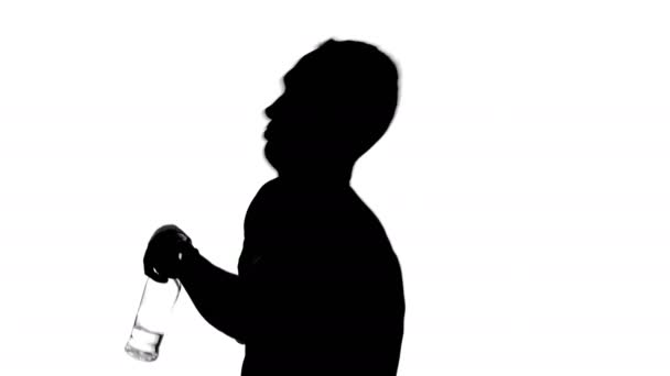 Footage of drinking man with bottle - Video