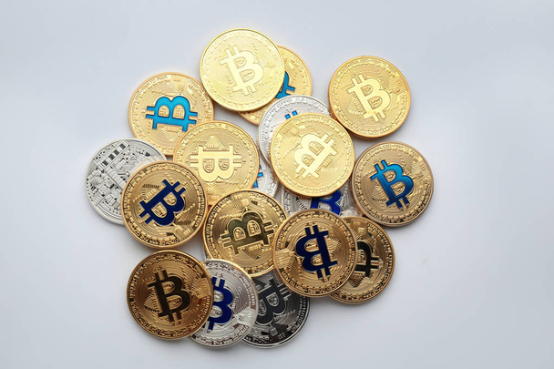 Many bitcoins on white background - Φωτογραφία, εικόνα
