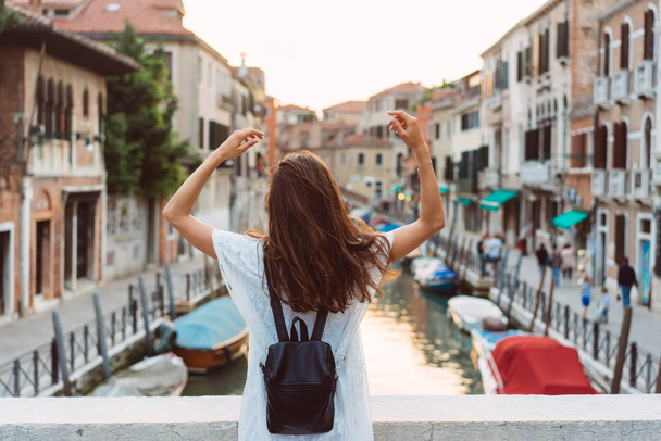 young girl walks the streets of Venice - 写真・画像