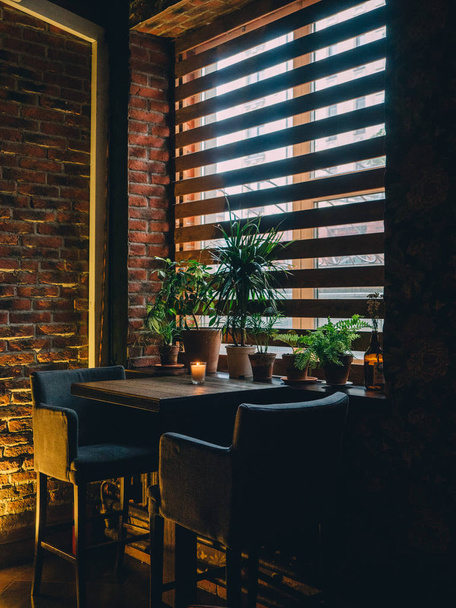 Dark interior with table and window of bar. - Valokuva, kuva