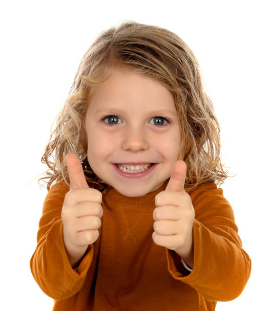 cute little boy in yellow pullover showing thumbs up isolated over white background - Photo, Image