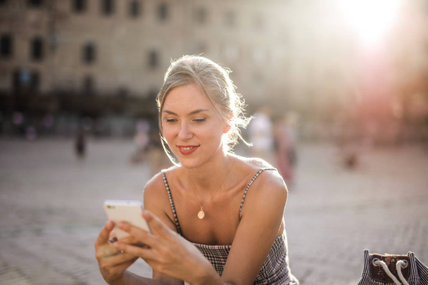 Blonde girl with the phone - Photo, image