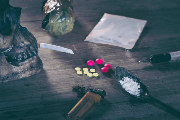 Collection of different hard drugs Heroin, Pills, Tobacco with Skull - Photo, Image
