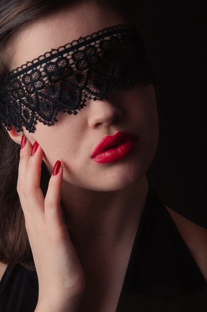 girl in a black lace mask - Фото, изображение