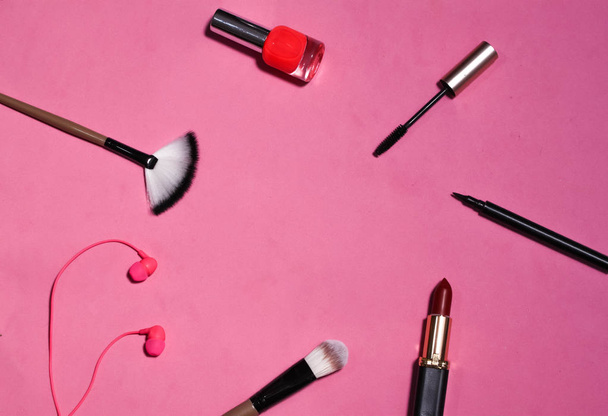 flat lay the tools to create makeup on pink background - Foto, Imagem