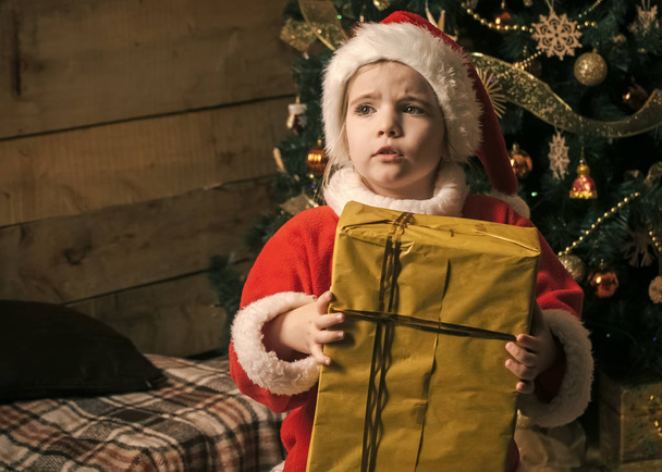 Christmas happy child with present box. - Фото, зображення