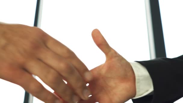 Business partner, man and woman, shake hands close up when meeting. Slow motion - Footage, Video
