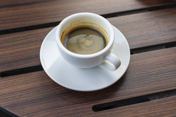 Espresso coffee  in wooden tray, black background. - Fotografie, Obrázek