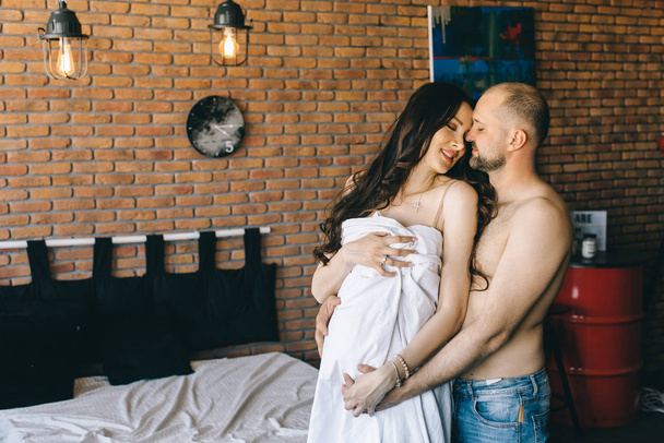 Couple in love pregnant lie in bed cuddling, waiting for baby - Φωτογραφία, εικόνα