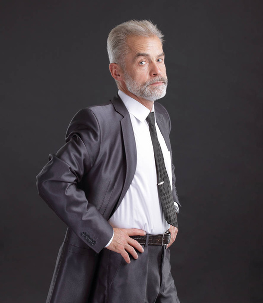 confident senior businessman. isolated on dark background - Fotografie, Obrázek