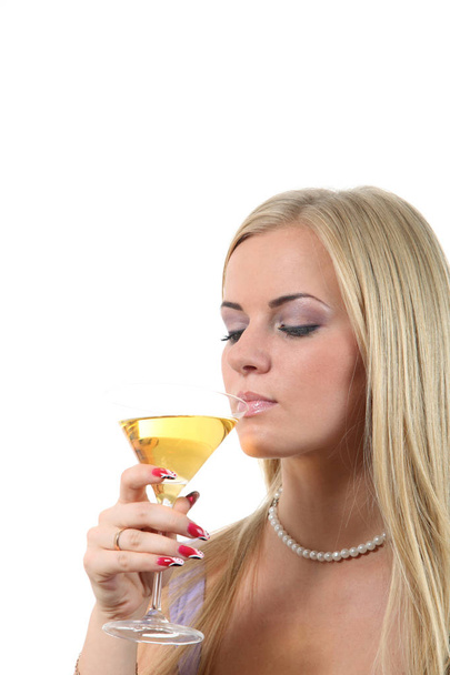 Luxuriously young blond woman drinking  Martini - Zdjęcie, obraz