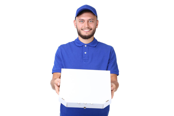 Delivery man with pizza in cardboard box isolated on white background - Zdjęcie, obraz