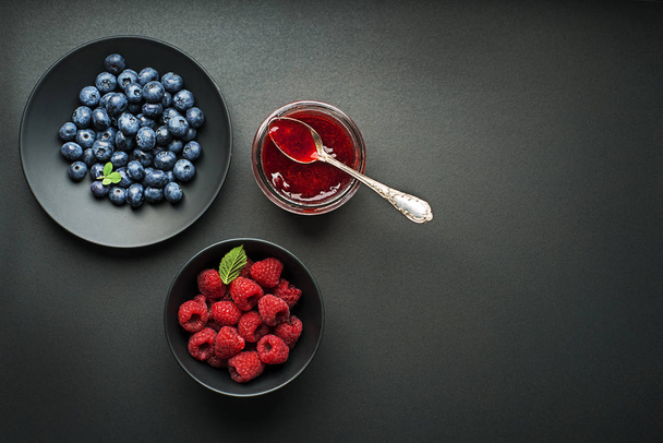 Homemade marmalede or jam from fresh mixed berries  - 写真・画像