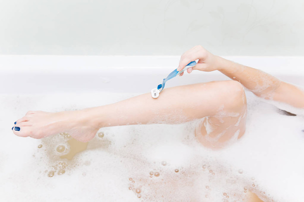 young woman is relaxing in a bathtube - Foto, Imagem