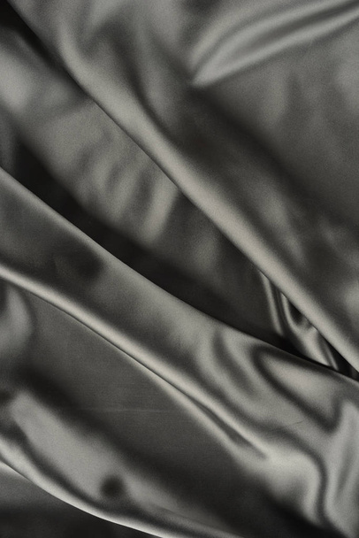 Effects of light in one gray satin fabric - 写真・画像