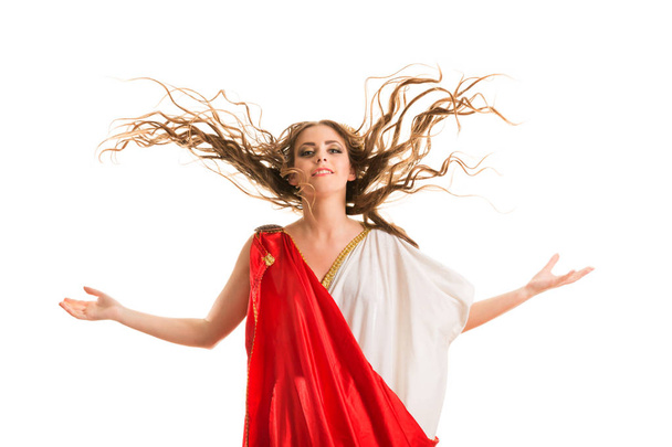 Antigua diosa en una toga griega roja aislada sobre un fondo blanco
 - Foto, Imagen